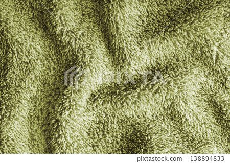 Crumpled fluffy khaki terry towel microfiber fabric texture with wrinkles and waves background 138894833