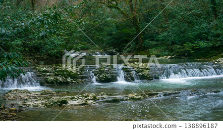 cascade of waterfalls in mountain forest cascade of waterfalls in mountain forest 138896187