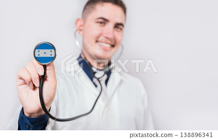Doctor showing stethoscope with Honduras flag. Honduras national healthcare concept Doctor showing stethoscope with Honduras flag. Honduras national healthcare concept 138896341
