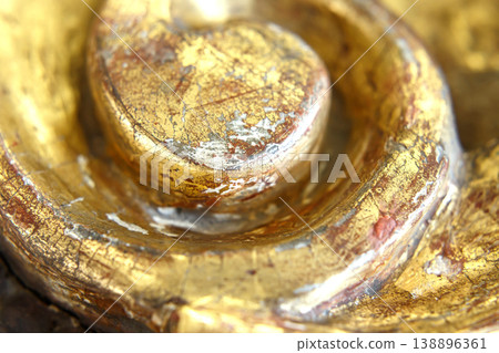 Close up View of a Golden Sculpture Showing Details of Texture and Color in a Museum Gallery Setting Close up View of a Golden Sculpture Showing Details of Texture and Color in a Museum Gallery Setting 138896361