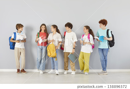 Group Of Diverse Students Standing On Grey Background Group Of Diverse Students Standing On Grey Background 138896372