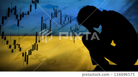 financial crisis and inflation in Ukraine. Silhouette of a stressed person against the Ukrainian flag, falling stock market charts, and 500 hryvnia banknotes background. Economic recession concept financial crisis and inflation in Ukraine. Silhouette of a stressed person against the Ukrainian flag, falling stock market charts, and 500 hryvnia banknotes background. Economic recession concept 138896573