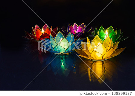 Vesak day. Floating colorful lotus candles glowing on water surface 138899187