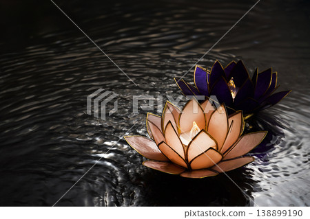 Vesak day. Lotus candles floating on water bringing spiritual peace Vesak day. Lotus candles floating on water bringing spiritual peace 138899190