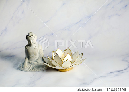 Vesak day. Buddha statue and lotus candle for meditation and wellness Vesak day. Buddha statue and lotus candle for meditation and wellness 138899196