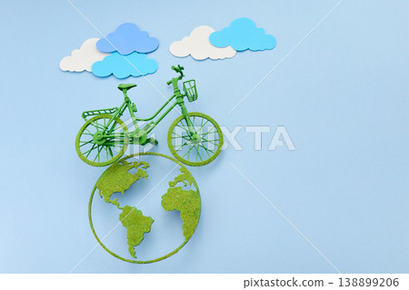 World bicycle day. Green bicycle riding a clean energy path on planet earth 138899206