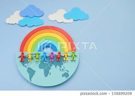 Diverse people holding hands on world map under rainbow Diverse people holding hands on world map under rainbow 138899209