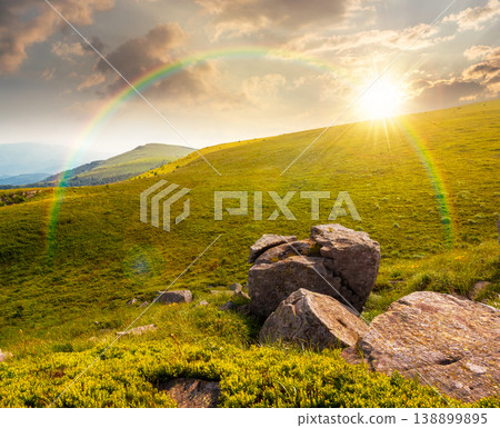 sunset over mountain summer landscape. meadow with giant stones among the grass on the hillside. awe view near the peak of mountain smooth in evening dappled light. great outdoors. weather with sunset over mountain summer landscape. meadow with giant stones among the grass on the hillside. awe view near the peak of mountain smooth in evening dappled light. great outdoors. weather with 138899895
