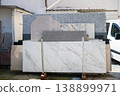 Marble and granite stone slabs display in outdoor construction materials yard 138899971