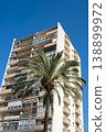 Modern apartment building with palm tree against clear blue sky in Barcelona 138899972