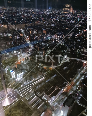 A panoramic view of the city at night from a high-rise building. A panoramic view of the city at night from a high-rise building. 138900322