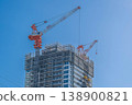 A tower crane soars into the blue sky, and a construction site for a high-rise building (Leafia Tower Ebina) 138900821