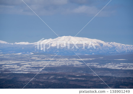 A snow-capped, solitary peak rising from the plains of Hokkaido in winter. A breathtaking landscape representative of Hokkaido's magnificent nature. Capturing the majestic natural beauty of Hokkaido. A snow-capped, solitary peak rising from the plains of Hokkaido in winter. A breathtaking landscape representative of Hokkaido's magnificent nature. Capturing the majestic natural beauty of Hokkaido. 138901249