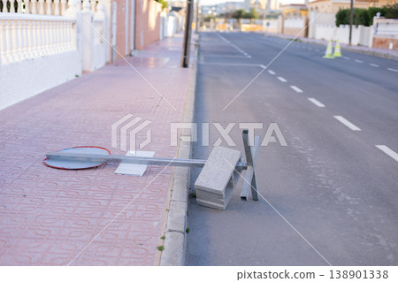 Fallen by storm road sign in the city Fallen by storm road sign in the city 138901338