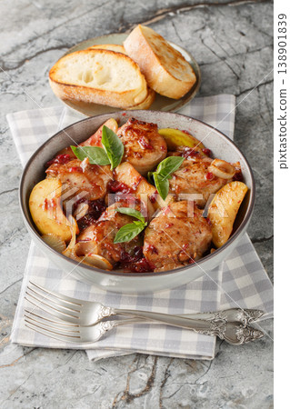 Roasted pork medallions with apples, french onion and berry served with toasted bread closeup. Vertical Roasted pork medallions with apples, french onion and berry served with toasted bread closeup. Vertical 138901839