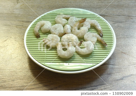 raw frozen shrimp food ingredient arranging on plate 138902009