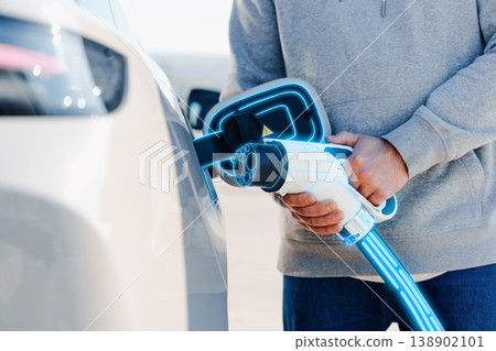 Electric car charging station with digital display showing battery information and usage data Electric car charging station with digital display showing battery information and usage data 138902101