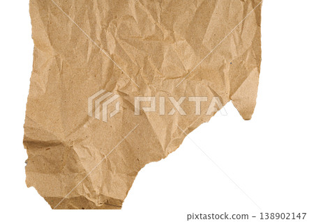 Crumpled brown kraft paper texture isolated on white background. Ripped recycled paper sheet. Crumpled brown kraft paper texture isolated on white background. Ripped recycled paper sheet. 138902147