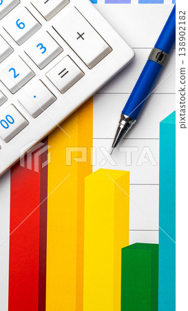 Understanding data analysis with calculator and pen on colorful chart Understanding data analysis with calculator and pen on colorful chart 138902182