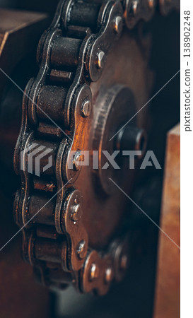 Close view of a bicycle chain on a gear system in a workshop during daylight 138902248