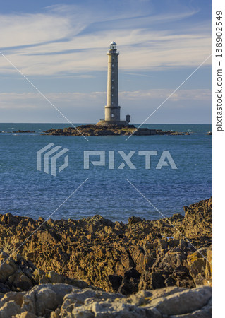 Gatteville lighthouse standing tall above rocky coastline in Normandy, France 138902549