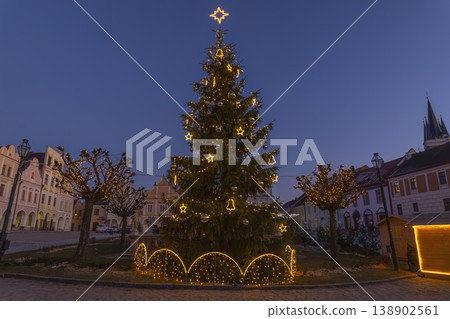 Christmas tree adorning Telc town square at dusk 138902561