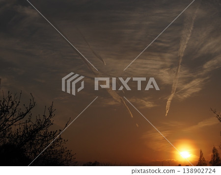 The sunset sky and the setting sun The sunset sky and the setting sun 138902724