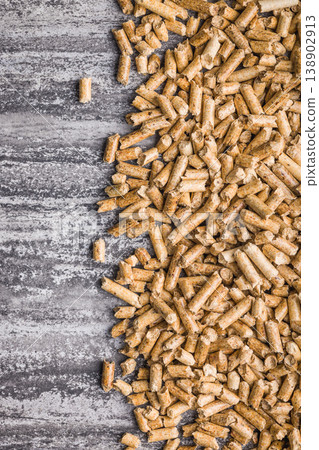 Pile Of Wood Pellets For Biomass Fuel And Home Heating On Concrete Surface Pile Of Wood Pellets For Biomass Fuel And Home Heating On Concrete Surface 138902913