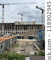 Construction Site with Temporary Worker Trailers and Tower Crane 138902945