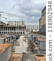 Construction Site with Temporary Worker Trailers and Tower Crane 138902948