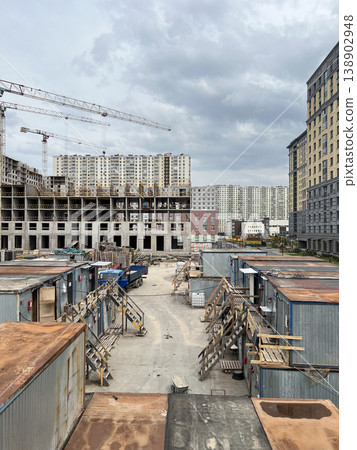 Construction Site with Temporary Worker Trailers and Tower Crane Construction Site with Temporary Worker Trailers and Tower Crane 138902948