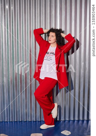 White woman with curly hair showcasing energetic singing stance White woman with curly hair showcasing energetic singing stance 138903464