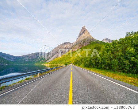 Scenic road view of Mount Stetinden in Norway. Scenic road view of Mount Stetinden in Norway. 138903768
