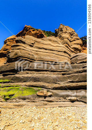 The beautiful geological formations and impressive rock face scenery of Chiza no Iwaya on Tanegashima Island. The beautiful geological formations and impressive rock face scenery of Chiza no Iwaya on Tanegashima Island. 138904566