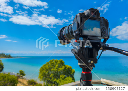 Serene beach landscape with ocean, trees, and clouds Serene beach landscape with ocean, trees, and clouds 138905127