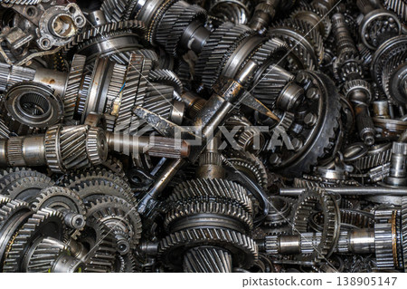 Close-up of discarded mechanical gears and shafts in workshop 138905147