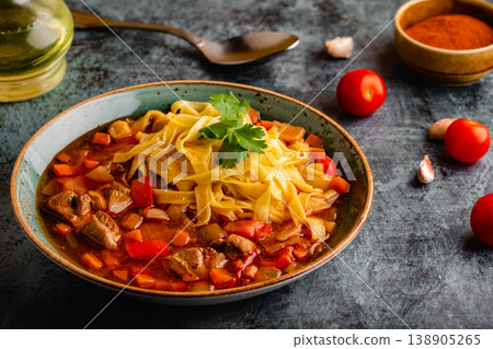 Lagman soup with lamb, homemade noodles and vegetables. 138905265