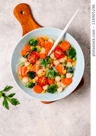 Soup with mini dumplings and vegetables. 138905296