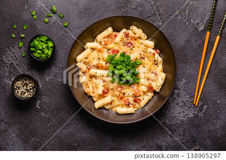 Spicy Rice Cake with Cheese and Bacon or Cream Teokbokki, Tteokbokki. Spicy Rice Cake with Cheese and Bacon or Cream Teokbokki, Tteokbokki. 138905297