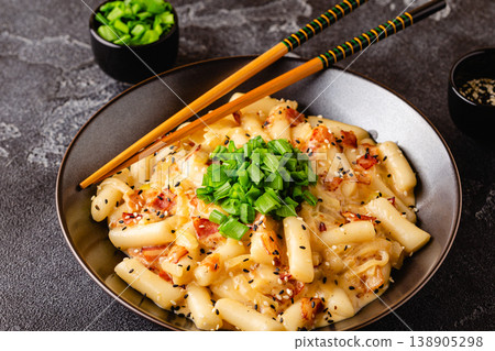Spicy Rice Cake with Cheese and Bacon or Cream Teokbokki, Tteokbokki. Spicy Rice Cake with Cheese and Bacon or Cream Teokbokki, Tteokbokki. 138905298