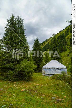 Traditional yurt dwelling in serene mountainous landscape of Kyrgyzstan Traditional yurt dwelling in serene mountainous landscape of Kyrgyzstan 138905421