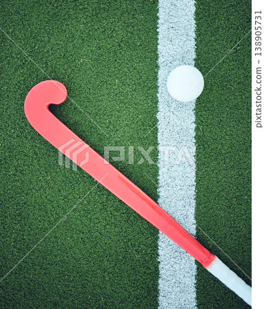 Turf field, stick hockey and sports ground for game, competition and training gear. Green pitch or grass flatlay at a sport event with workout, exercise or athlete equipment and ball on a playground 138905731