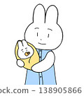 一隻母兔抱著她的小兔子。 138905866