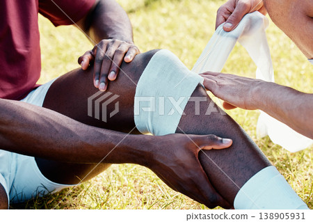 Rugby, knee injury and bandage with a sports black man on a field struggling with pain during a game. Fitness, medical and anatomy with a male athlete on a field suffering from an accident outdoor Rugby, knee injury and bandage with a sports black man on a field struggling with pain during a game. Fitness, medical and anatomy with a male athlete on a field suffering from an accident outdoor 138905931