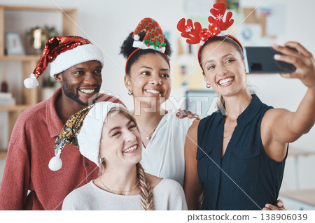 Christmas party, phone selfie and business people in celebration of festive holiday. Diversity, smile and happy work friends celebrating on 5g mobile, social media picture post or happy office memory Christmas party, phone selfie and business people in celebration of festive holiday. Diversity, smile and happy work friends celebrating on 5g mobile, social media picture post or happy office memory 138906039