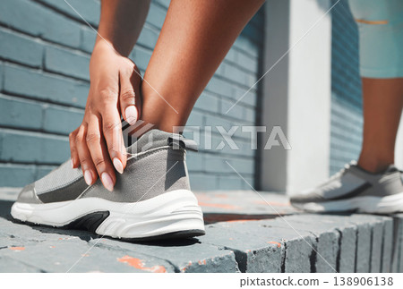 Woman, hand and shoes in fitness stretching for sports exercise, training or warm up for urban workout. Female hands on shoe for stretch, run or motivation for comfortable footwear for healthy cardio Woman, hand and shoes in fitness stretching for sports exercise, training or warm up for urban workout. Female hands on shoe for stretch, run or motivation for comfortable footwear for healthy cardio 138906138