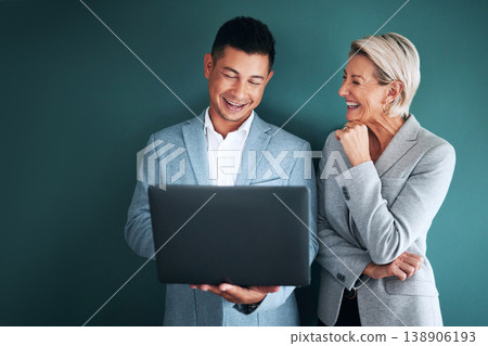Laptop, teamwork and planning with a business team in studio on a green background for strategy. Computer, collaboration or management with a man and woman working on growth as company leadership 138906193