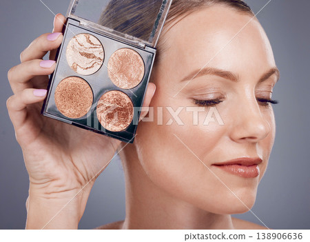 Makeup pallet, woman with face and beauty with cosmetics product, foundation and eye powder on studio background. Smile, cosmetic care and cosmetology, eyeshadow or blush, closeup and advertising Makeup pallet, woman with face and beauty with cosmetics product, foundation and eye powder on studio background. Smile, cosmetic care and cosmetology, eyeshadow or blush, closeup and advertising 138906636