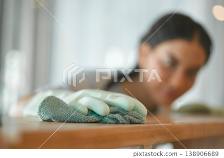 Cleaning, hands and a woman at a table to clean surface from dirt, dust or bacteria for healthy home. Fabric or cloth of maid or cleaner wipe wood furniture with polish or chemical to disinfect 138906689