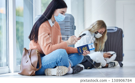 Passport, covid and mask, travel with smartphone for communication after canceled flight. Woman, compliance of health and safety rules, vaccination and traveling restriction during pandemic. Passport, covid and mask, travel with smartphone for communication after canceled flight. Woman, compliance of health and safety rules, vaccination and traveling restriction during pandemic. 138906784